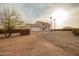 Two-story desert home featuring gravel driveway and privacy fence at 1819 W Joy Ranch Rd, Phoenix, AZ 85086