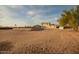 An exterior elevation of the property showcasing a home with a gazebo, expansive property, and desert landscape at 1819 W Joy Ranch Rd, Phoenix, AZ 85086