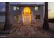 The front entry has white columns and a warm, inviting glow at 1819 W Joy Ranch Rd, Phoenix, AZ 85086