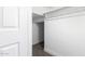 Hallway with white walls and trim featuring a small storage space at 1819 W Joy Ranch Rd, Phoenix, AZ 85086