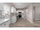 Bright kitchen with white cabinets, stainless steel appliances, and a back door for easy access at 1819 W Joy Ranch Rd, Phoenix, AZ 85086