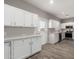 White cabinets, quartz countertops, and stainless-steel appliances highlight this remodeled kitchen at 1819 W Joy Ranch Rd, Phoenix, AZ 85086