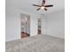 Carpeted bedroom featuring an ensuite bathroom and access to the kitchen at 18445 W Pasadena Ave, Litchfield Park, AZ 85340