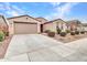 Beautiful single-Gathering home featuring a well-kept lawn and inviting entrance at 18445 W Pasadena Ave, Litchfield Park, AZ 85340