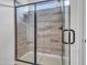 Modern shower with glass door, tiled walls and a built-in niche at 18445 W Pasadena Ave, Litchfield Park, AZ 85340