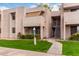 Well-maintained exterior of a townhome with manicured lawns and inviting entrances at 1920 W Lindner W Ave # 277, Mesa, AZ 85202