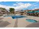 Community pool and spa surrounded by ample seating and well-maintained landscaping at 1920 W Lindner W Ave # 277, Mesa, AZ 85202