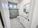 Contemporary bathroom showcasing a glass shower, floating sink, and tiled flooring at 22536 W Huntington Dr, Buckeye, AZ 85326