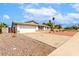 Single-story home with desert landscaping, paved driveway, two car garage, and partial fencing in a low traffic area at 2540 E Riviera Dr, Tempe, AZ 85282