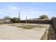 Large backyard featuring a concrete patio, gravel, and a partial privacy fence at 2601 E Willetta St, Phoenix, AZ 85008