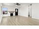 Inviting living room boasting a decorative fireplace, modern ceiling fan, and plenty of natural light at 2601 E Willetta St, Phoenix, AZ 85008
