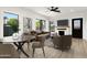 Stylishly furnished living area with a fireplace, modern ceiling fan, and ample natural light at 2601 E Willetta St, Phoenix, AZ 85008