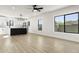 Open-concept living and kitchen area with sleek stainless steel appliances and ample natural light at 2601 E Willetta St, Phoenix, AZ 85008