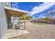 View of a backyard with a covered patio area and a gravel landscape at 2607 W Ironstone Ave, Apache Junction, AZ 85120