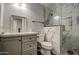 Bathroom features a marble tiled shower with a built-in niche and grey vanity at 2607 W Ironstone Ave, Apache Junction, AZ 85120