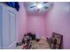 This pink bedroom features wood floors and is messy at 2607 W Ironstone Ave, Apache Junction, AZ 85120