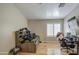 This messy bedroom features wood floors, a closet, and a bed at 2607 W Ironstone Ave, Apache Junction, AZ 85120