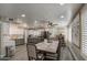Bright dining area with seating for eight and stylish gray and white cabinets at 2607 W Ironstone Ave, Apache Junction, AZ 85120