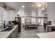Open-concept dining area with modern decor, stainless appliances, and backyard views at 2607 W Ironstone Ave, Apache Junction, AZ 85120