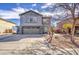 Charming two-story home with gray stucco, a two-car garage, and desert landscaping in the front yard at 2607 W Ironstone Ave, Apache Junction, AZ 85120