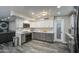 Updated kitchen with modern appliances, white subway tile backsplash, and gray lower cabinets at 2607 W Ironstone Ave, Apache Junction, AZ 85120