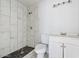 Modern bathroom featuring tiled shower and flooring, with updated fixtures at 2609 N 65Th Dr, Phoenix, AZ 85035