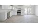 Well-lit kitchen featuring new appliances and bright white cabinetry and a sliding glass door at 2609 N 65Th Dr, Phoenix, AZ 85035