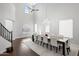 Bright dining room featuring a chandelier, high ceilings, and large windows at 280 W Wisteria Pl, Chandler, AZ 85248