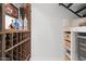 Wine cellar with custom wood racking and a beverage refrigerator at 280 W Wisteria Pl, Chandler, AZ 85248
