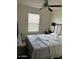 Spacious main bedroom featuring neutral colors and natural light through the window at 30386 N Juniper Dr, Florence, AZ 85132