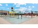 This splash pad with interactive water features offers safe fun for children of all ages at 30386 N Juniper Dr, Florence, AZ 85132