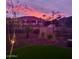 Backyard landscape and fencing, creating a private retreat at twilight at 3074 N 167Th Dr, Goodyear, AZ 85395
