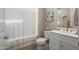 Clean and modern bathroom with a combination shower and tub, vanity, and neutral decor at 3074 N 167Th Dr, Goodyear, AZ 85395