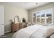 Relaxing bedroom with light walls, plantation shutters, and comfortable furnishings at 3074 N 167Th Dr, Goodyear, AZ 85395