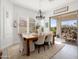 Charming dining room with natural light and sliding glass doors to backyard patio at 3074 N 167Th Dr, Goodyear, AZ 85395