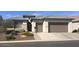 Charming single-story home with a well-manicured front yard and three-car garage in a desirable community at 3074 N 167Th Dr, Goodyear, AZ 85395