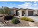 Charming single-story home with a well-maintained front yard and three-car garage at 3074 N 167Th Dr, Goodyear, AZ 85395