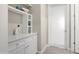 Clean hallway with cabinets, shelves, and white trim at 3074 N 167Th Dr, Goodyear, AZ 85395