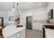 Modern kitchen with an island, stainless steel appliances, and ample cabinet space at 3074 N 167Th Dr, Goodyear, AZ 85395