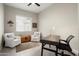 Office area with desk, chairs, neutral colors and ample lighting at 3074 N 167Th Dr, Goodyear, AZ 85395