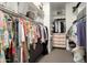 Organized walk-in closet with shelving, hanging rods, and ample storage space at 3074 N 167Th Dr, Goodyear, AZ 85395