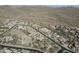 Scenic aerial shot showcasing a neighborhood nestled in the desert with homes and paved roads at 32742 N 15Th Gln, Phoenix, AZ 85085