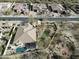 Aerial view of a private residence with a pool, putting green, and well-kept landscaping at 32742 N 15Th Gln, Phoenix, AZ 85085