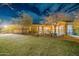 View of the backyard, featuring a well manicured lawn, desert landscaping, and patio at 32742 N 15Th Gln, Phoenix, AZ 85085