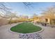 Spacious backyard with a manicured lawn and mature landscaping at 32742 N 15Th Gln, Phoenix, AZ 85085