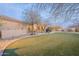 Lush backyard with well-maintained artificial turf and xeriscaping, creating a tranquil outdoor space for relaxation at 32742 N 15Th Gln, Phoenix, AZ 85085