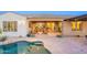 Inviting outdoor living area overlooking the pool with comfortable seating and seamless transition to indoor spaces at 32742 N 15Th Gln, Phoenix, AZ 85085