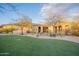 Expansive backyard featuring artificial turf, desert landscaping, and wrought iron fencing for secure outdoor enjoyment at 32742 N 15Th Gln, Phoenix, AZ 85085