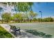 Community basketball court with a shaded bench seating and desert landscaping at 32742 N 15Th Gln, Phoenix, AZ 85085