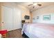 Bedroom with a sliding closet door, a ceiling fan, and a neutral color scheme at 32742 N 15Th Gln, Phoenix, AZ 85085